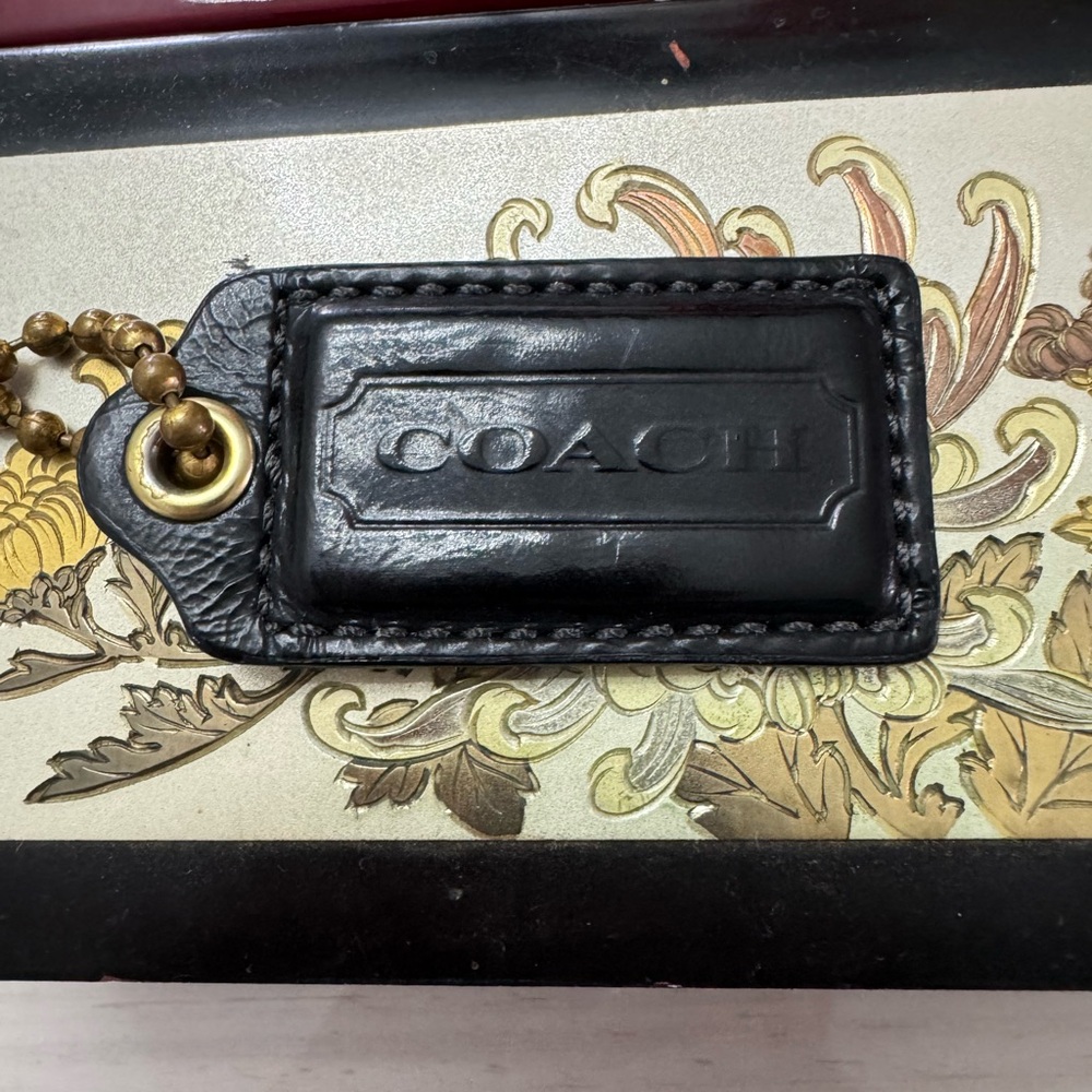 Coach Black Leather Tag with Gold Accent